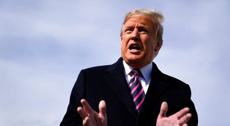 President Donald Trump talks to the media before he boards Air Force One for a trip to Los Angeles to attend a campaign fundraiser, Tuesday, Feb. 18, 2020, at Andrews Air Force Base, Md. (AP Photo/Evan Vucci) President Donald Trump talks to the media before he boards Air Force One for a trip to Los Angeles to attend a campaign fundraiser, Tuesday, Feb. 18, 2020, at Andrews Air Force Base, Md. (AP Photo/Evan Vucci)
