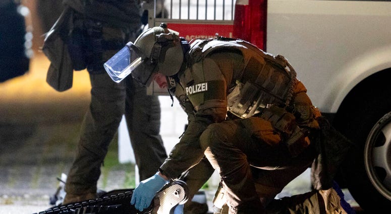 A special forces officer works on a robot in front of a house that is searched through by police in Hanau, Germany Thursday, Feb. 20, 2020. (AP Photo/Michael Probst) A special forces officer works on a robot in front of a house that is searched through by police in Hanau, Germany Thursday, Feb. 20, 2020. (AP Photo/Michael Probst)