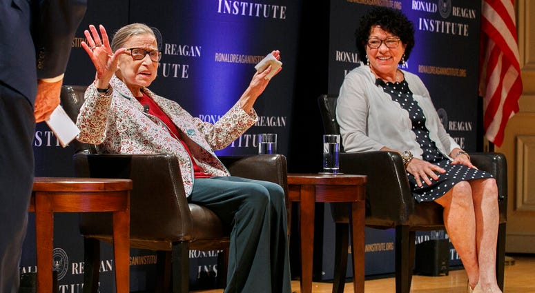 In this Sept. 25, 2019 file photo, Supreme Court Justice Ruth Bader Ginsburg, left, holds up her hands as she and Supreme Court Justice Sonia Sotomayor arrive to applause for a panel discussion. (AP Photo/Jacquelyn Martin) In this Sept. 25, 2019 file photo, Supreme Court Justice Ruth Bader Ginsburg, left, holds up her hands as she and Supreme Court Justice Sonia Sotomayor arrive to applause for a panel discussion. (AP Photo/Jacquelyn Martin)