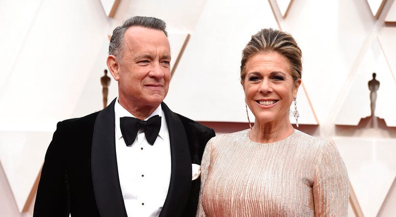 FILE - In this Feb. 9, 2020 file photo, Tom Hanks, left, and Rita Wilson arrive at the Oscars at the Dolby Theatre in Los Angeles. (Photo by Jordan Strauss/Invision/AP, File) FILE - In this Feb. 9, 2020 file photo, Tom Hanks, left, and Rita Wilson arrive at the Oscars at the Dolby Theatre in Los Angeles. (Photo by Jordan Strauss/Invision/AP, File)