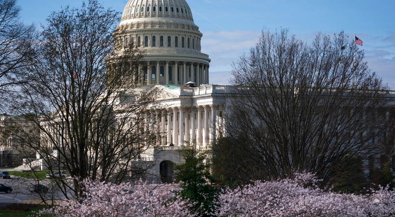 The Capitol is seen as lawmakers negotiate on the emergency coronavirus response legislation, at the Capitol in Washington, Wednesday, March 18, 2020. (AP Photo/J. Scott Applewhite) The Capitol is seen as lawmakers negotiate on the emergency coronavirus response legislation, at the Capitol in Washington, Wednesday, March 18, 2020. (AP Photo/J. Scott Applewhite)