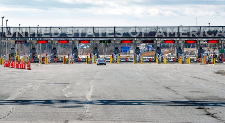 A vehicle approaches the only open lane at the United States border crossing in Lacolle, Quebec, Wednesday, March 18, 2020. (Ryan Remiorz/The Canadian Press via AP) A vehicle approaches the only open lane at the United States border crossing in Lacolle, Quebec, Wednesday, March 18, 2020. (Ryan Remiorz/The Canadian Press via AP)