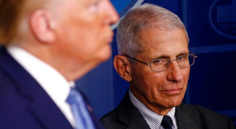 Director of the National Institute of Allergy and Infectious Diseases Dr. Anthony Fauci, right, and President Donald Trump listen as Vice President Mike Pence speaks during a coronavirus task force briefing at the White House. (AP Photo/Patrick Semansky) Director of the National Institute of Allergy and Infectious Diseases Dr. Anthony Fauci, right, and President Donald Trump listen as Vice President Mike Pence speaks during a coronavirus task force briefing at the White House. (AP Photo/Patrick Semansky)