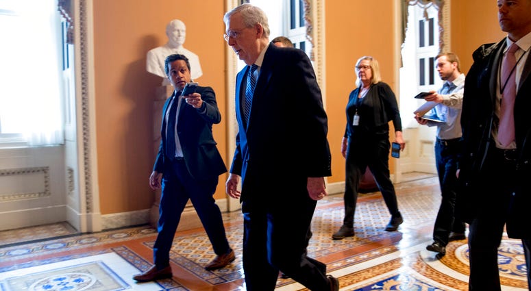 Senate Majority Leader Mitch McConnell of Ky. arrives on Capitol Hill in Washington, Monday, March 23, 2020, as the Senate is working to pass a coronavirus relief bill. (AP Photo/Andrew Harnik) Senate Majority Leader Mitch McConnell of Ky. arrives on Capitol Hill in Washington, Monday, March 23, 2020, as the Senate is working to pass a coronavirus relief bill. (AP Photo/Andrew Harnik)