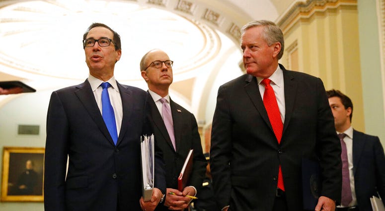 Treasury Secretary Steven Mnuchin, left, accompanied by White House Legislative Affairs Director Eric Ueland and acting White House chief of staff Mark Meadows. (AP Photo/Patrick Semansky) Treasury Secretary Steven Mnuchin, left, accompanied by White House Legislative Affairs Director Eric Ueland and acting White House chief of staff Mark Meadows. (AP Photo/Patrick Semansky)