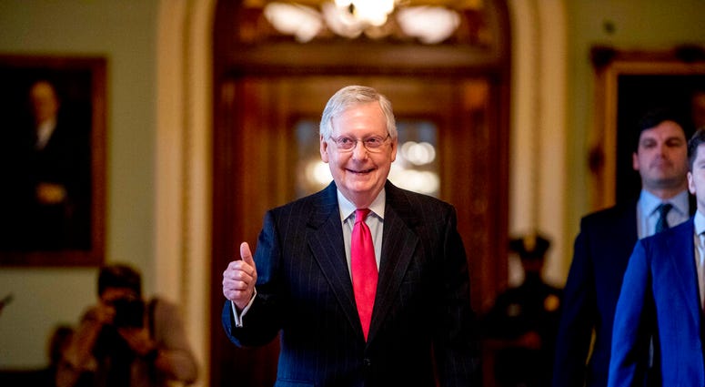 Senate Majority Leader Mitch McConnell of Ky. gives a thumbs up as he leaves the Senate chamber on Capitol Hill in Washington, Wednesday, March 25, 2020. (AP Photo/Andrew Harnik) Senate Majority Leader Mitch McConnell of Ky. gives a thumbs up as he leaves the Senate chamber on Capitol Hill in Washington, Wednesday, March 25, 2020. (AP Photo/Andrew Harnik)