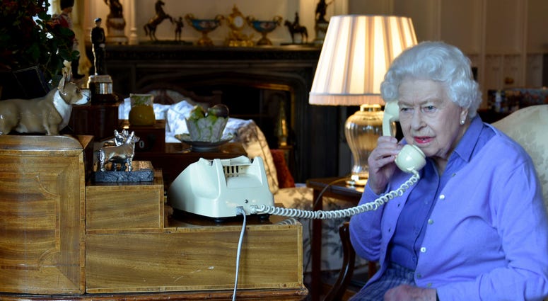 In this photo made available by Buckingham Palace, Britain's Queen Elizabeth II speaks to Prime Minister Boris Johnson from Windsor Castle, Windsor, England, Wednesday March 25, 2020, for her weekly audience. (Buckingham Palace via AP) In this photo made available by Buckingham Palace, Britain's Queen Elizabeth II speaks to Prime Minister Boris Johnson from Windsor Castle, Windsor, England, Wednesday March 25, 2020, for her weekly audience. (Buckingham Palace via AP)