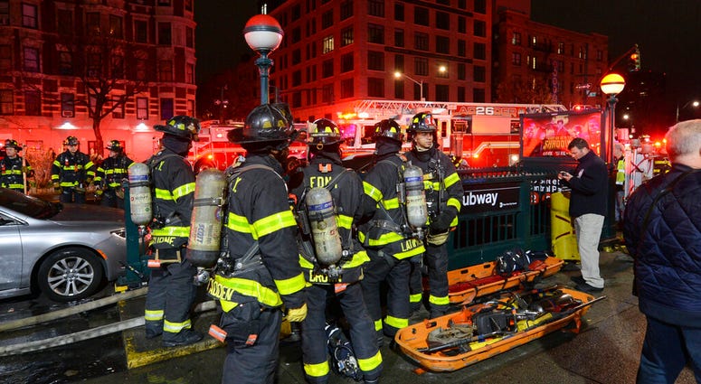 In this image released by the MTA New York City Transit, New York City firefighters assemble at a subway station in New York, Friday, March 27, 2020.