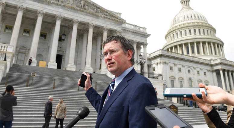 Rep. Thomas Massie, R-Ky., talks to reporters before leaving Capitol Hill in Washington, Friday, March 27, 2020, after attempting to slow action on a rescue package.