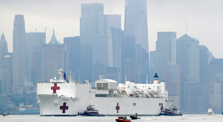 he Navy hospital ship USNS Comfort passes lower Manhattan on its way to docking in New York, Monday, March 30, 2020. (AP Photo/Seth Wenig) The Navy hospital ship USNS Comfort passes lower Manhattan on its way to docking in New York, Monday, March 30, 2020. (AP Photo/Seth Wenig)