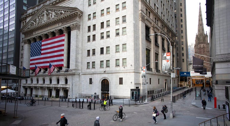 A few people walk on Wall Street in front of the New York Stock Exchange in New York. (AP Photo/Mark Lennihan, File) A few people walk on Wall Street in front of the New York Stock Exchange in New York. (AP Photo/Mark Lennihan, File)