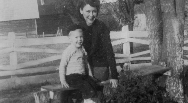 In this image provided by the McConnell Center at the University of Louisville, Mitch McConnell sits with his mother Julia "Dean" McConnell on a bench in this image from the mid 1940's in Five Points, Ala..
