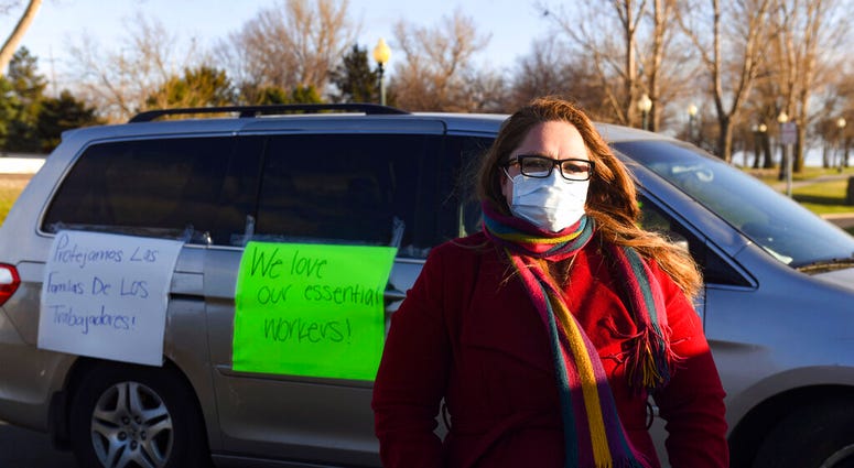 In this Thursday, April 9, 2020 photo, Nancy Reynoza, director of Que Pasa Sioux Falls, who organized a protest in solidarity with Smithfield Food, Inc. (Erin Bormett/The Argus Leader via AP) In this Thursday, April 9, 2020 photo, Nancy Reynoza, director of Que Pasa Sioux Falls, who organized a protest in solidarity with Smithfield Food, Inc. (Erin Bormett/The Argus Leader via AP)