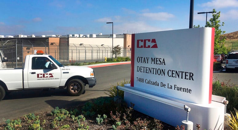 FILE - In this June 9, 2017, file photo, a vehicle drives into the Otay Mesa detention center in San Diego. (AP Photo/Elliot Spagat, File) FILE - In this June 9, 2017, file photo, a vehicle drives into the Otay Mesa detention center in San Diego. (AP Photo/Elliot Spagat, File)