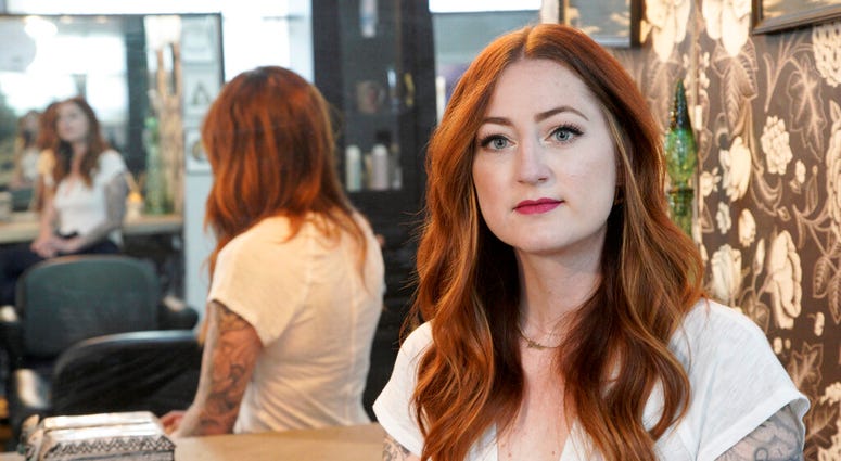 Hairstylist Lacey Ward poses for a photo at the Grey House Salon she co-owns, in Omaha, Neb., Thursday, April 30, 2020. (AP Photo/Nati Harnik) Hairstylist Lacey Ward poses for a photo at the Grey House Salon she co-owns, in Omaha, Neb., Thursday, April 30, 2020. (AP Photo/Nati Harnik)