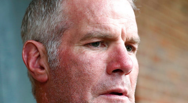 FILE - In this Oct. 17, 2018, file photo, former NFL quarterback Brett Favre speaks with reporters in Jackson, Miss., about his support for Willowood Developmental Center, a facility that provides training and assistance for special needs students