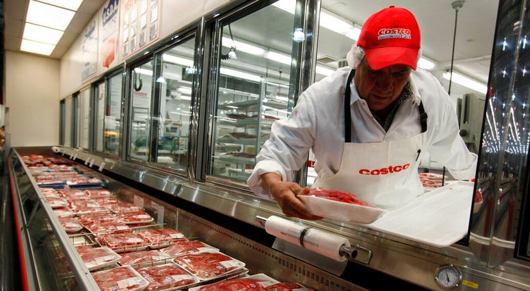 In this Dec. 8, 2009 file photo, a butcher places beef on display at Costco in Mountain View, Calif. U.S. meat supplies are dwindling due to coronavirus-related production shutdowns.