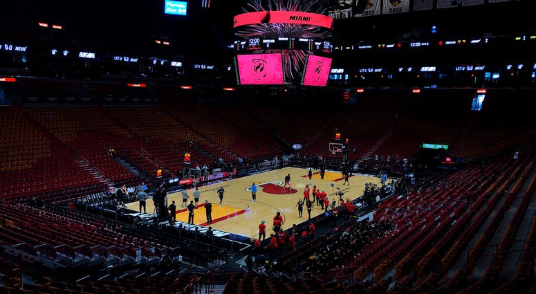 FILE - In this Oct. 23, 2019, file photo, the Miami Heat and the Memphis Grizzlies practice before an NBA basketball game in Miami, Fla.