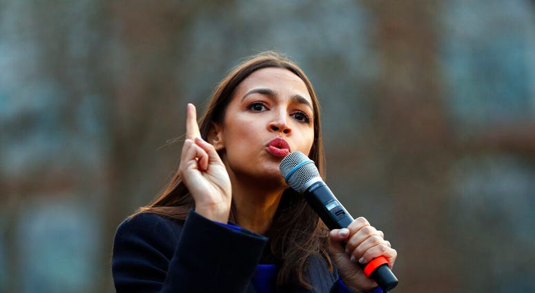 FILE - In this March 8, 2020, file photo Rep. Alexandria Ocasio-Cortez, D-NY., speaks at a campaign rally for then-Democratic presidential candidate Sen. Bernie Sanders, I-Vt., at the University of Michigan in Ann Arbor, Mich.