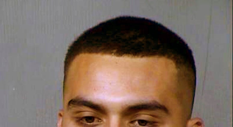 This booking photo provided by the Maricopa County Sheriff's Office shows 20-year-old Armando Hernandez Jr., who was arrested on suspicion of aggravated assault and other crimes in a shooting Wednesday, May 20, 2020, near a shopping and entertainment dist