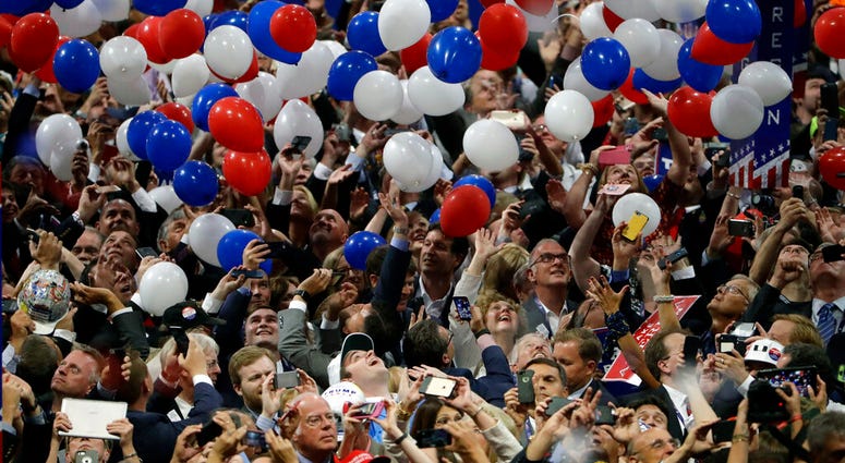 FILE - In this July 21, 2016, file photo, confetti and balloons fall during celebrations after Republican presidential candidate Donald Trump's acceptance speech on the final day of the Republican National Convention in Cleveland.