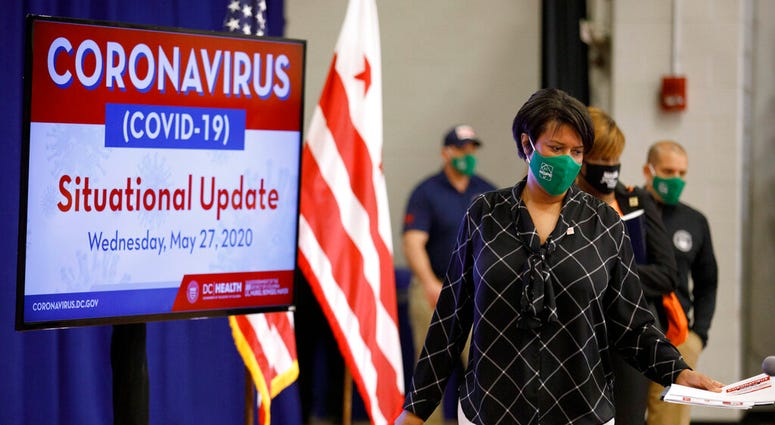strict of Columbia Mayor Muriel Bowser arrives for a news conference, Wednesday, May 27, 2020, in Washington. Bowser announced the start of the Phase 1 response to the coronavirus in Washington is to begin Friday, May 29.