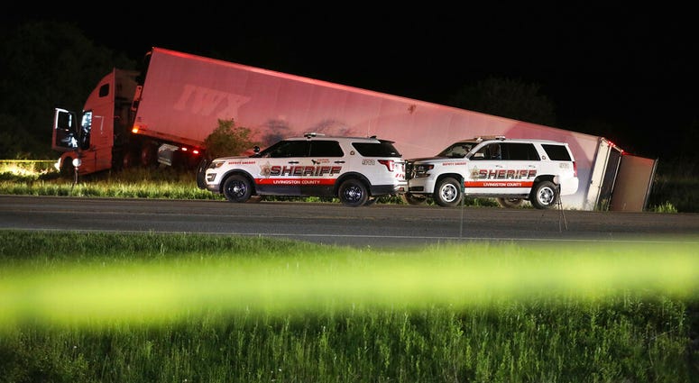 Livingston County Sheriff's work at the scene of cab of a tractor trailer after the driver was killed during a shootout with law enforcement officers, Thursday, May 28, 2020 on Rt. 20A in Geneseo, N.Y.