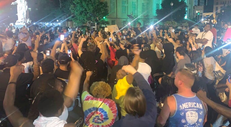 In a photo provided by Jada W., protesters gather Thursday, May 28, 2020, in downtown Louisville, Ky., against the police shooting of Breonna Taylor, a black woman fatally shot by police in her home in March.