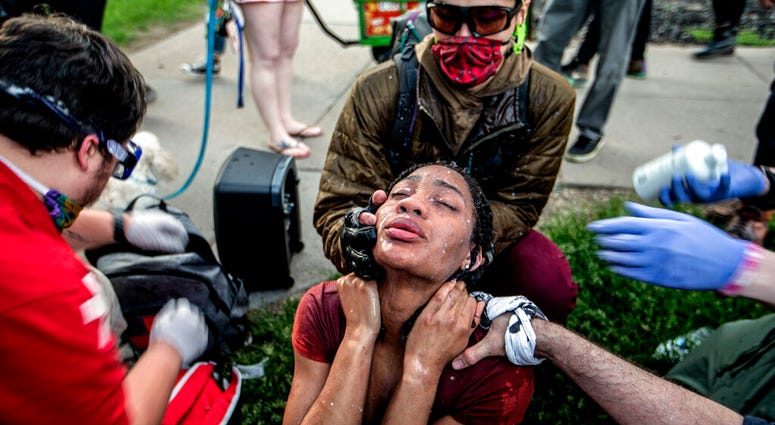 A protester receives care from street medics in Minneapolis, Saturday, May 30, 2020.
