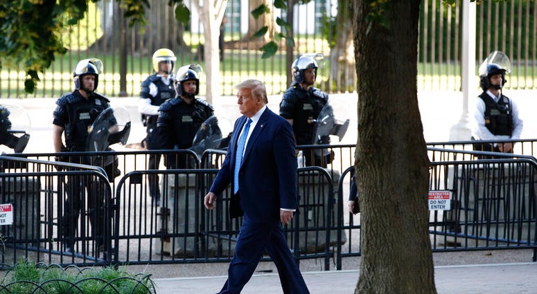 President Donald Trump walks in Lafayette Park to visit outside St. John's Church across from the White House Monday, June 1, 2020, in Washington. Part of the church was set on fire during protests on Sunday night.