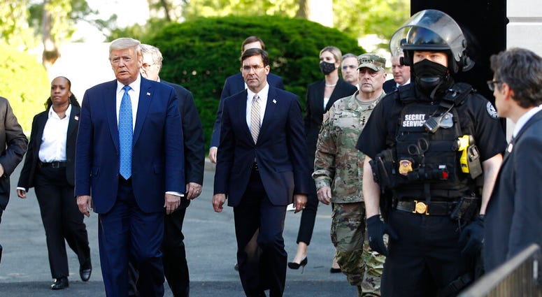 FILE - In this June 1, 2020, file photo President Donald Trump departs the White House to visit outside St. John's Church in Washington.