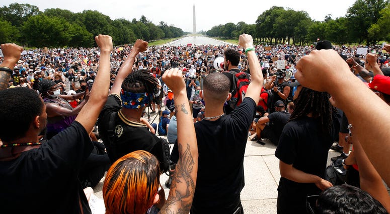 Demonstrators protest Saturday, June 6, 2020, at the Lincoln Memorial in Washington, over the death of George Floyd, a black man who was in police custody in Minneapolis.