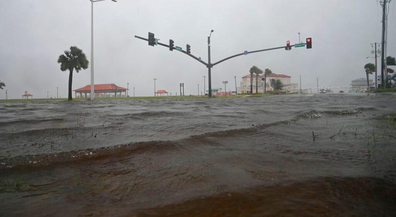 Storm surge covers US 90 in Long Beach, Miss., Sunday, June 7, 2020, on the Mississippi Gulf Coast ahead of Tropical Storm Cristobal’s landfall.