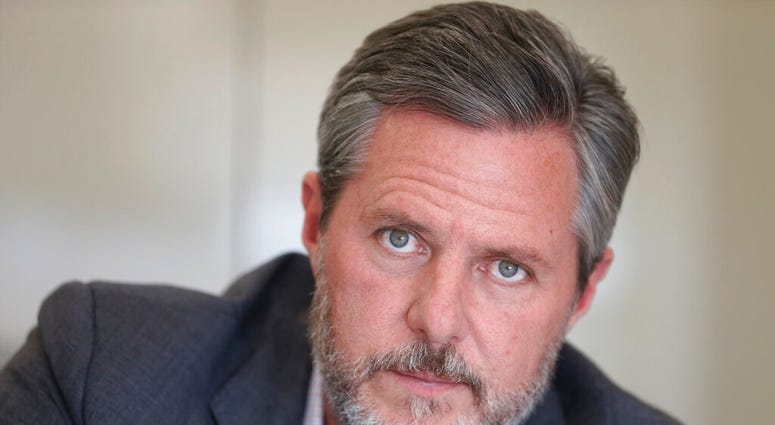 FILE - In this Nov. 16, 2016 file photo, Liberty University president Jerry Falwell Jr., poses during an interview in his offices at the school in Lynchburg, Va.