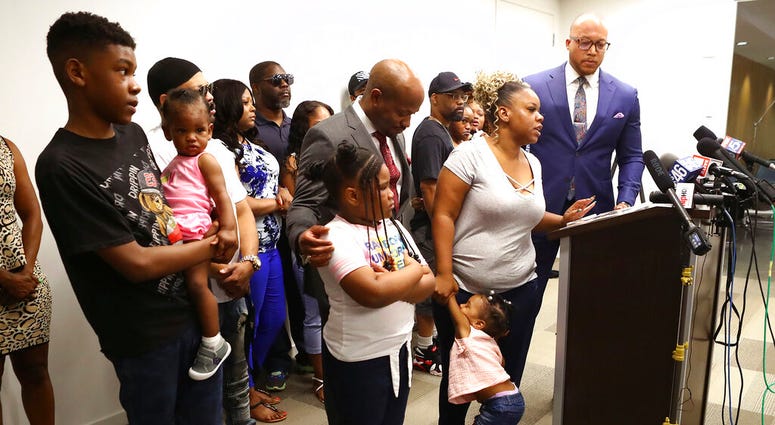 Tomika Miller, the wife of Rayshard Brooks, speaks in his memory with their children by her side saying the heartbroken family was determined that the tragedy of his death spark positive change during a press conference on Monday, June 15, 2020, in Atlant
