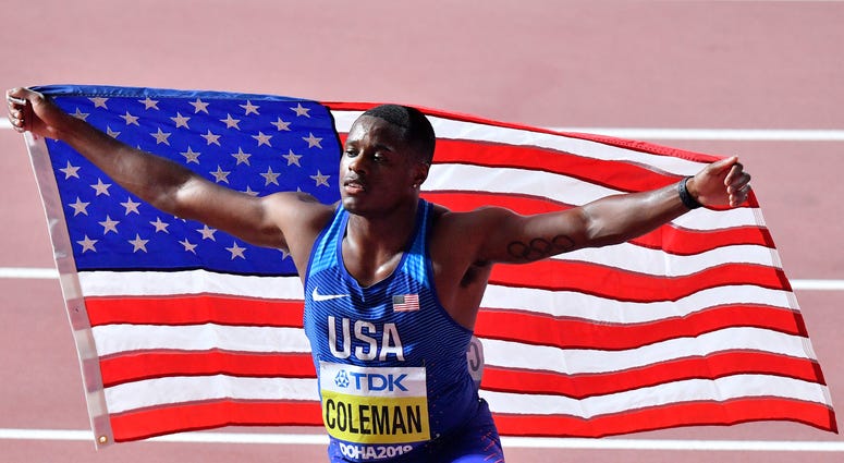 FILE - In this Sept. 28, 2019, file photo, Christian Coleman, of the United States, poses after winning the men's 100 meter race during the World Athletics Championships in Doha, Qatar.
