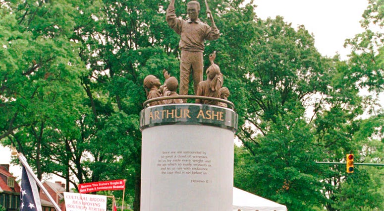 FILE - In this July 10, 1996 file photo, a crowd gathers at the base of the Arthur Ashe Monument after the ceremony dedicating the statue on Monument Avenue in Richmond, Va.