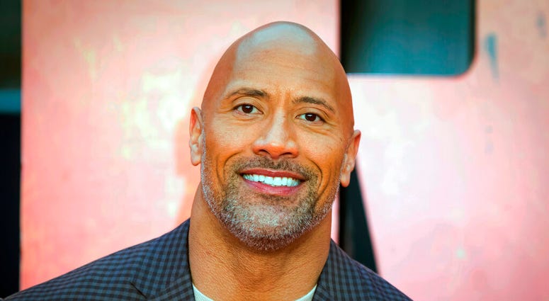 FILE - In this April 11, 2018, file photo, actor Dwayne Johnson poses for photographers at the premiere of the "Rampage," in London.