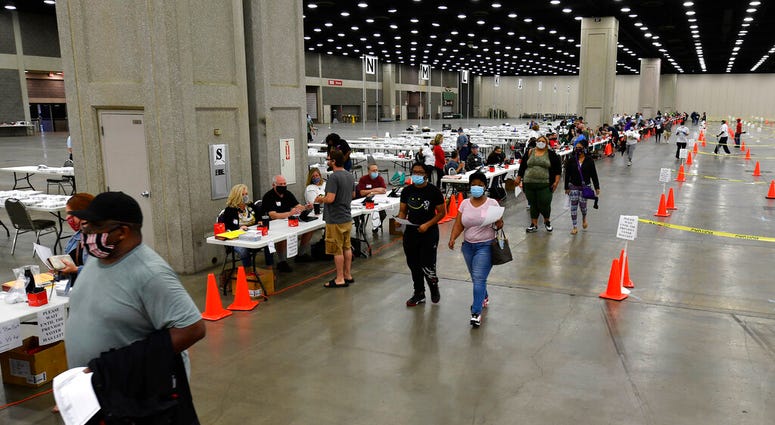 Voters head to the designated area to fill out their ballots in the kentucky primary at the Kentucky Exposition Center in Louisville, Ky., Tuesday, June 23, 2020.