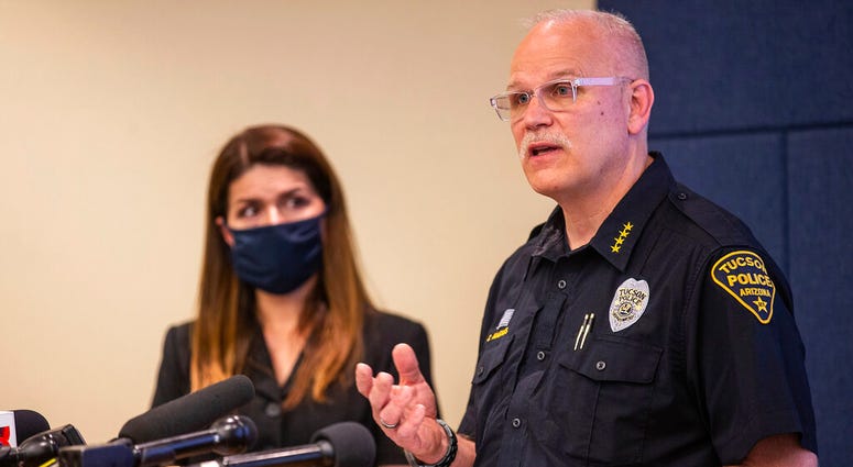 Tucson Police Chief Chris Magnus, right, speaks as Mayor Regina Romero listens during a press conference, Wednesday, June 24, 2020, in Tucson, Ariz.