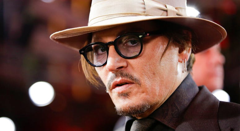 FILE - In this Friday, Feb. 21, 2020 file photo, actor Johnny Depp arrives for the screening of the film Minamata during the 70th International Film Festival Berlin, Berlinale in Berlin, Germany.
