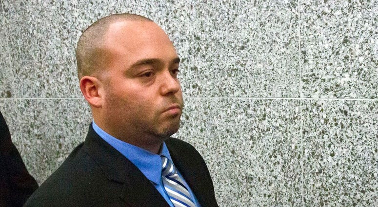 FILE - In this Nov. 5, 2014, file photo, New York City police officer David Afanador leaves state court in New York following his arraignment.