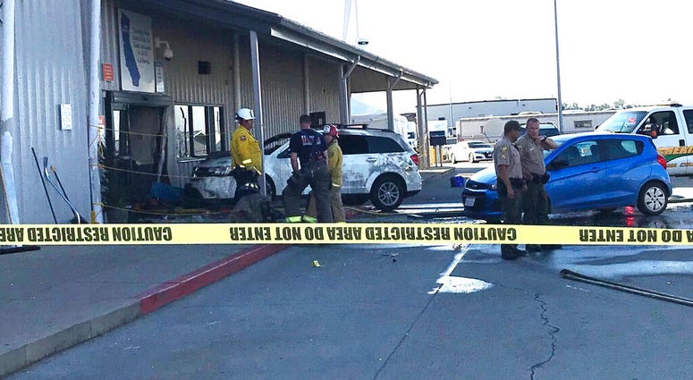 eputies and firefighters stand outside the Red Bluff Walmart distribution center after a man reportedly opened fire there and rammed his vehicle into the building, Saturday, June 27, 2020, in Red Bluff, Calif.