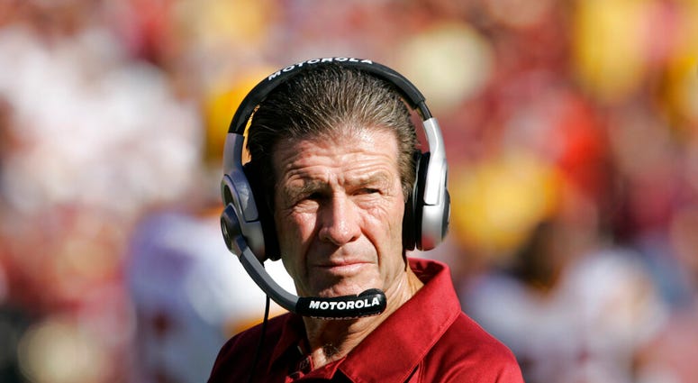FILE - In this Sept. 23, 2007, file photo, Washington Redskins assistant head coach-offensive Joe Bugel looks on during an NFL football game in Landover, Md.