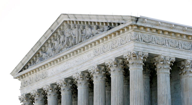 The sun rises behind the Supreme Court on Capitol Hill in Washington, Monday, June 29, 2020.