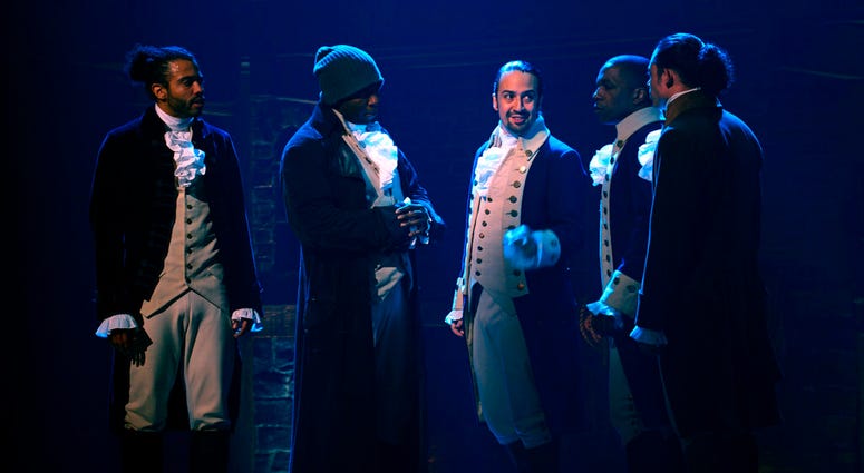 In this image released by Disney Plus, from left, Daveed Diggs, Okieriete Onaodowan, Lin-Manuel Miranda, Leslie Odom Jr. and Anthony Ramos appear in a filmed version of the original Broadway production of "Hamilton."