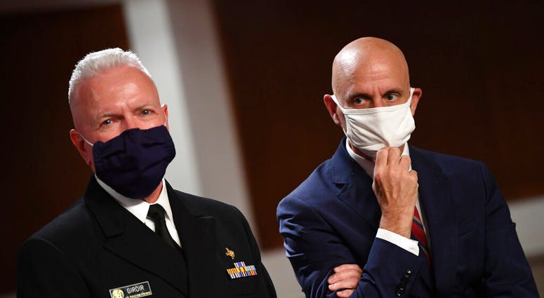 Adm. Brett Giroir, left, director of the U.S. coronavirus diagnostic testing, and Food and Drug Administration (FDA) Commissioner Stephen Hahn. (Kevin Dietsch/Pool via AP) Adm. Brett Giroir, left, director of the U.S. coronavirus diagnostic testing, and Food and Drug Administration (FDA) Commissioner Stephen Hahn. (Kevin Dietsch/Pool via AP)