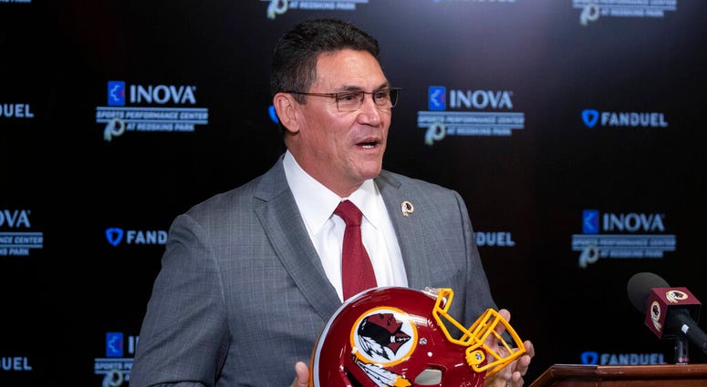 FILE - In this Jan. 2, 2020, file photo, Washington Redskins head coach Ron Rivera holds up a helmet during a news conference at the team's NFL football training facility in Ashburn, Va.