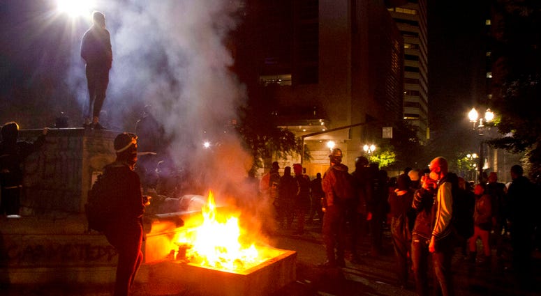 Twice on July Fourth, police declared a riot in downtown Portland, Ore., July 4, 2020.
