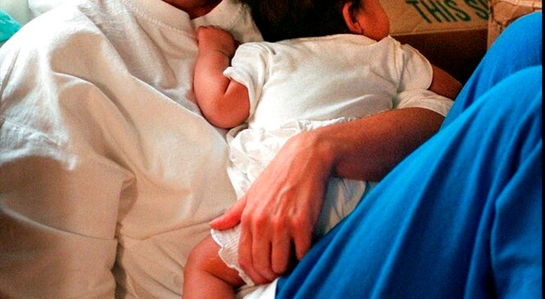 FILE - In this July 20, 1997, file photo, Mary Kay Letourneau holds the baby, in Normandy Park, Wash., that was fathered by a boy she once taught as an elementary school teacher.
